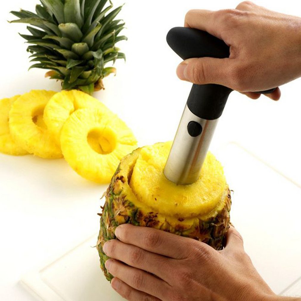 Roo Pineapple Corer twisting into a fresh pineapple